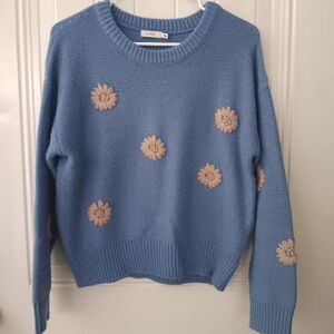 Blue Sweater with Floral Accents